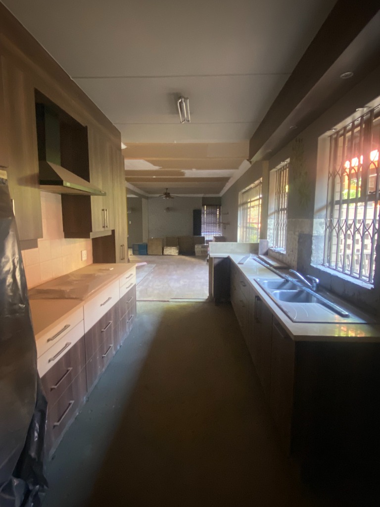 Kitchen cabinetry installation under construction - Fay Furnishings
